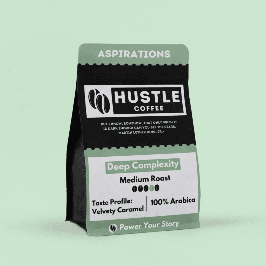 A bag of Aspirations Hustle Coffee (For Those Who See What Could Be) with the label "Deep Complexity," featuring a "Velvety Caramel" flavor and made from "100% Arabica" beans, perfect for crafting your finest espresso coffee moments. | Hustle Coffee