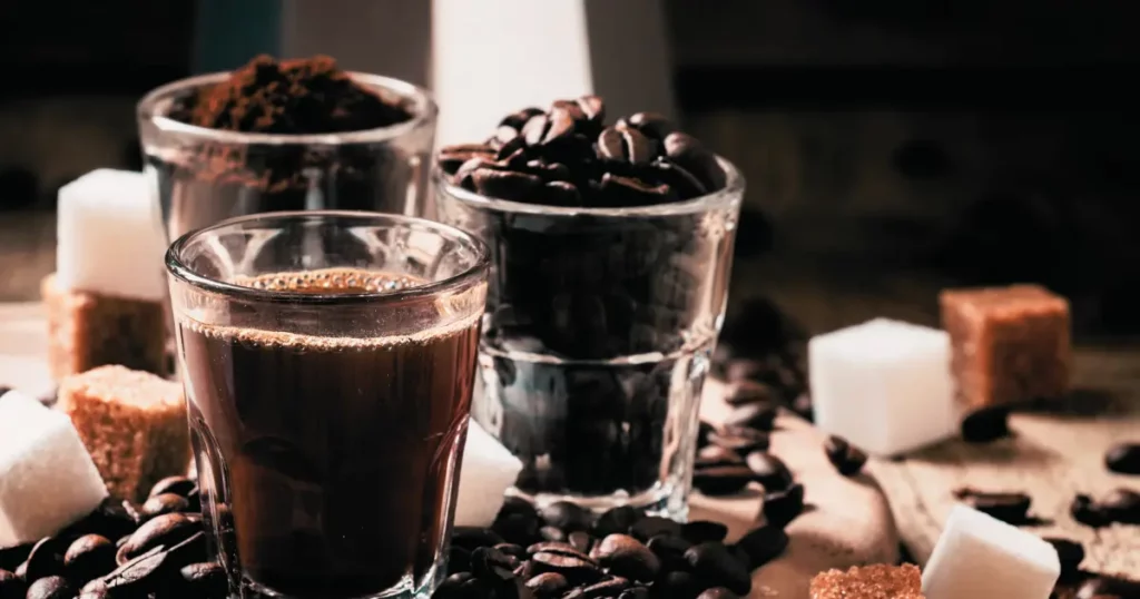coffee beans and sugar cubes on a wooden table | hustle coffee