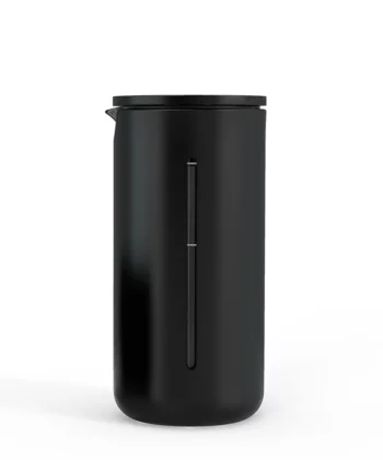 Black cylindrical container with lid and vertical indent along the side, set on a white background. | Hustle Coffee